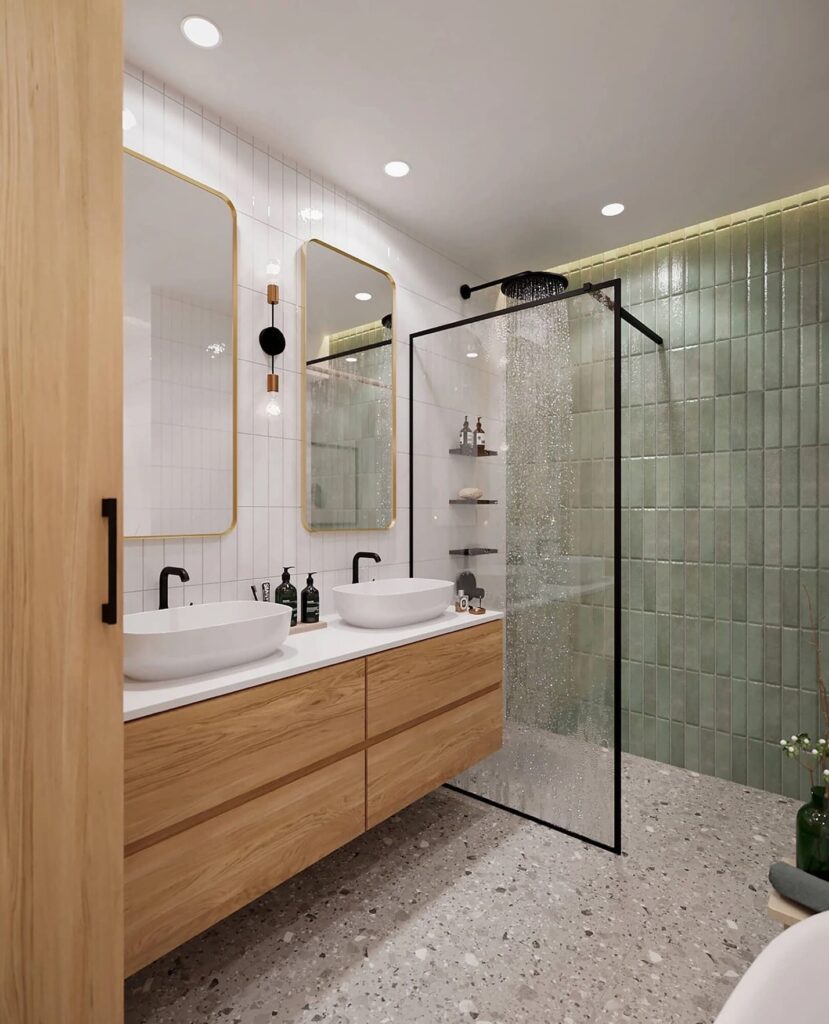 Modern bathroom with double vanity, terrazzo flooring, and a glass-enclosed shower area.