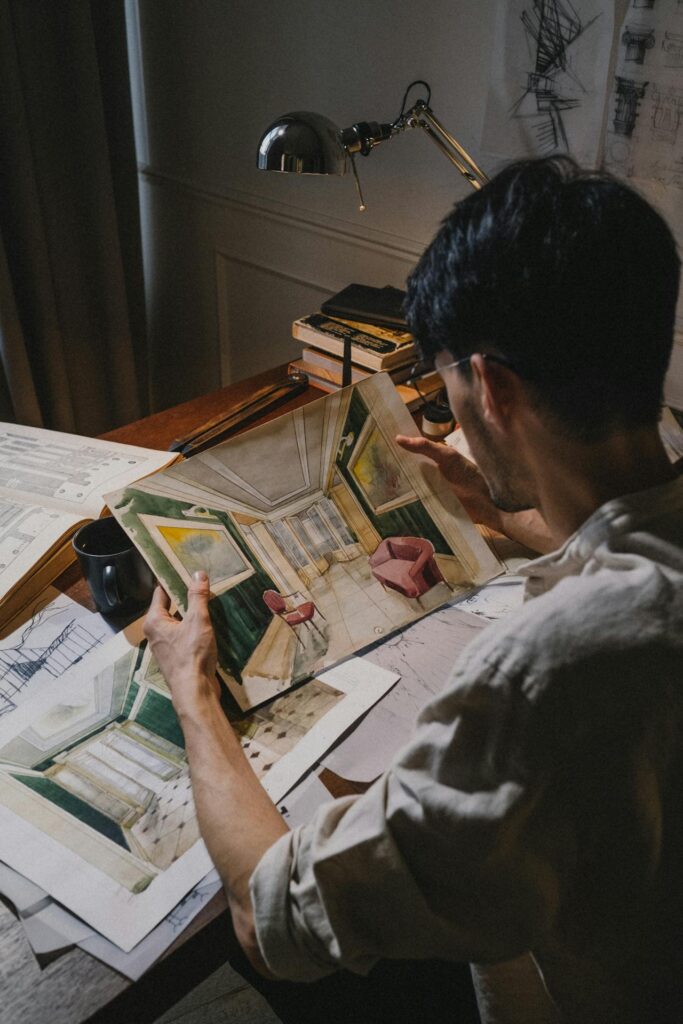 Person examining remodeling project at a desk